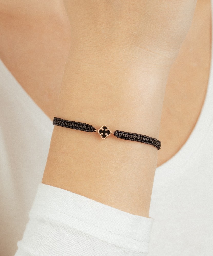 Black string bracelet with gold and onyxes