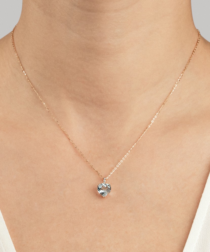 Gold pendant with topaz and zircons