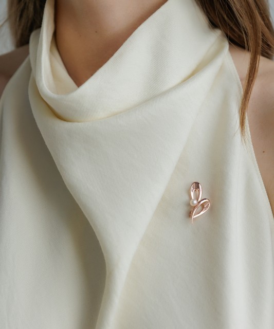 Gilded sterling silver brooch with pearl