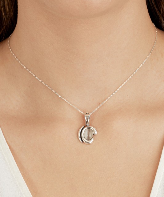 Sterling silver pendant with cats eye stone