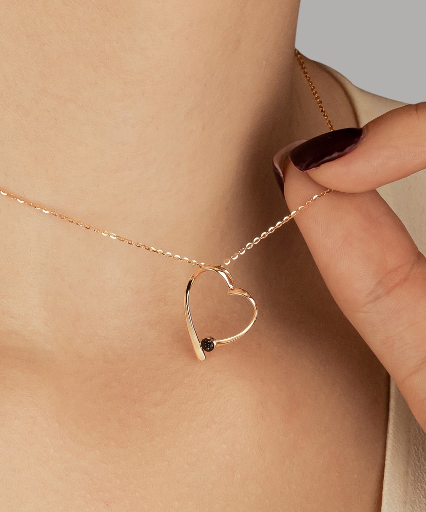 Gold pendant with black diamonds “Heart”