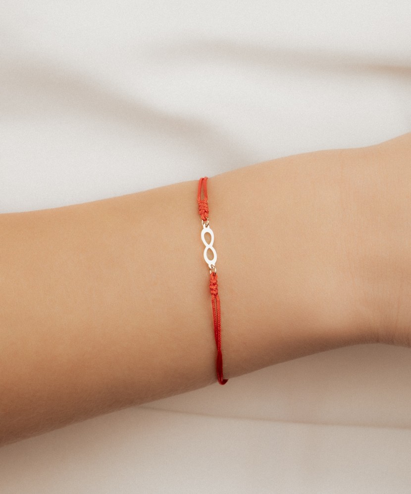 Red string bracelet with gold pendant "Infinity"