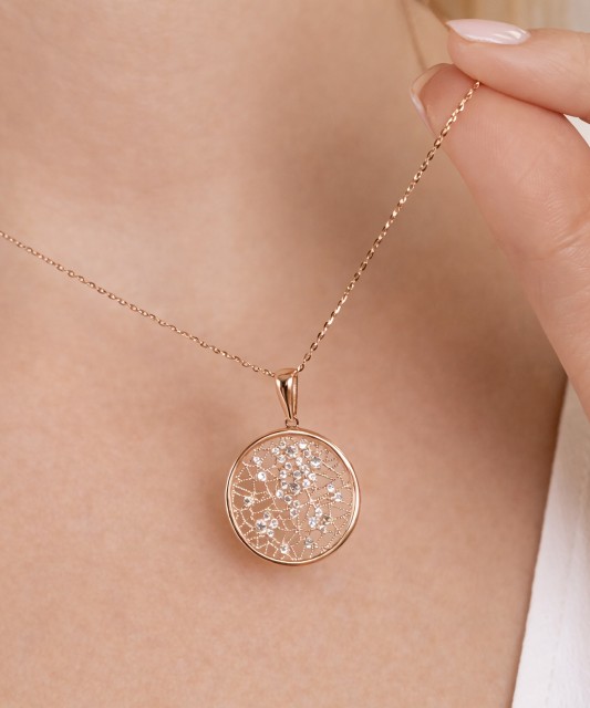 Gold pendant with zircons