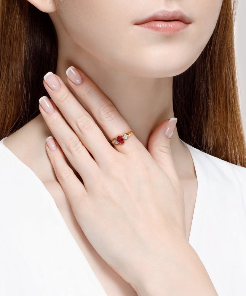 Gold ring with zircons and red corundum