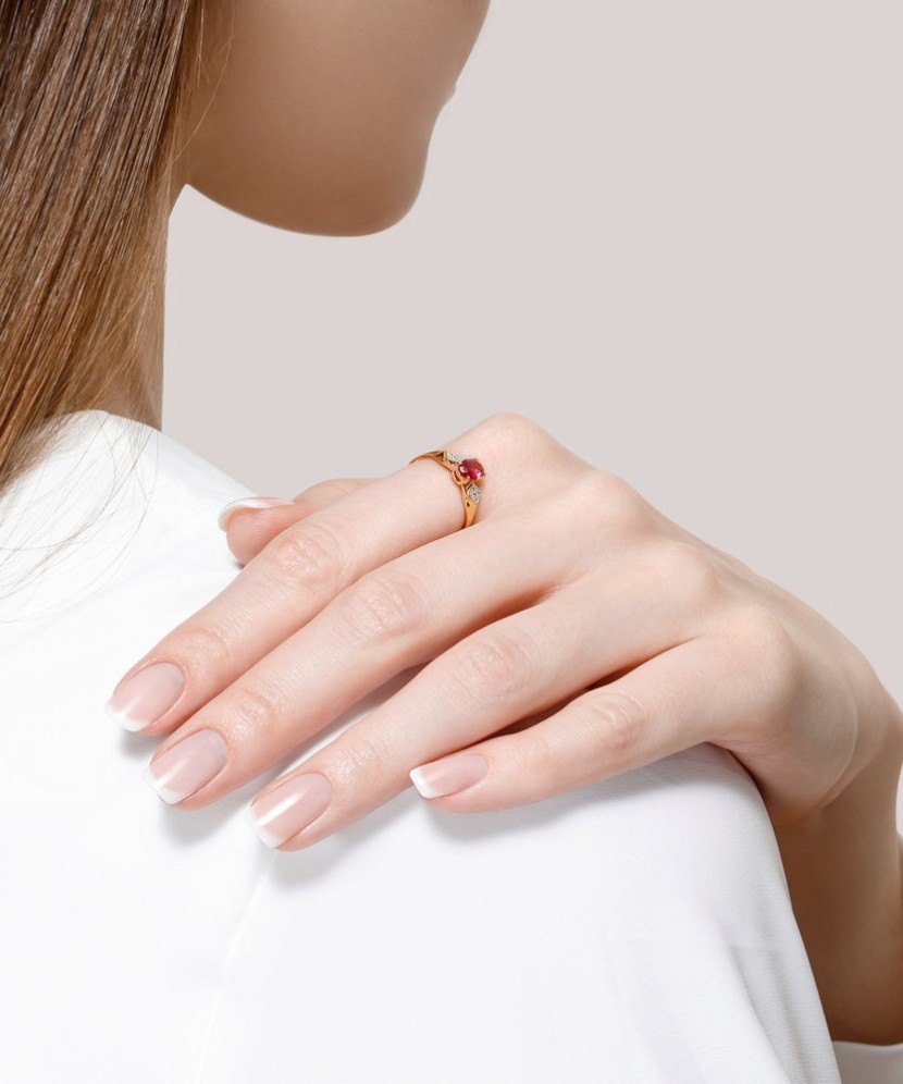 Gold ring with zircons and red corundum