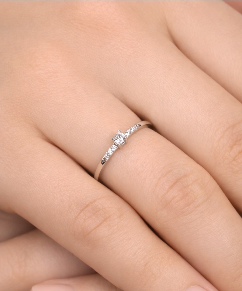 White gold ring with zircons