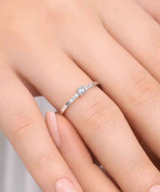 White gold ring with zircons