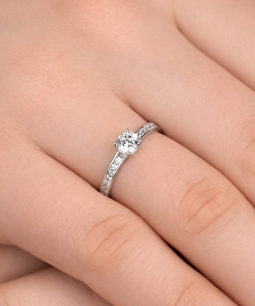 White gold ring with zircons