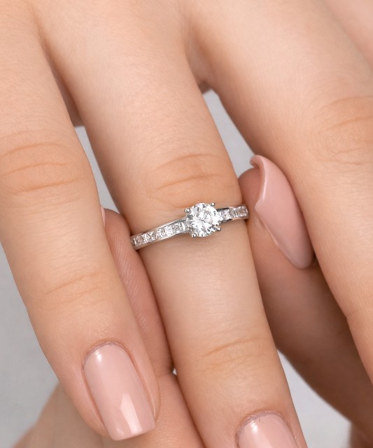 White gold ring with zircons