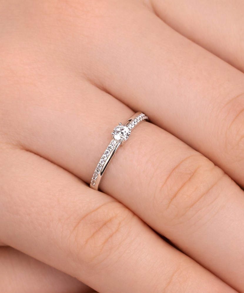 White gold ring with zircons