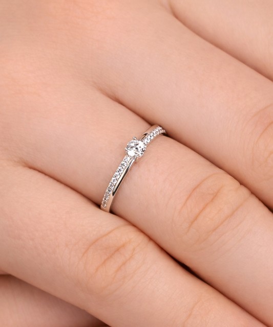 White gold ring with zircons