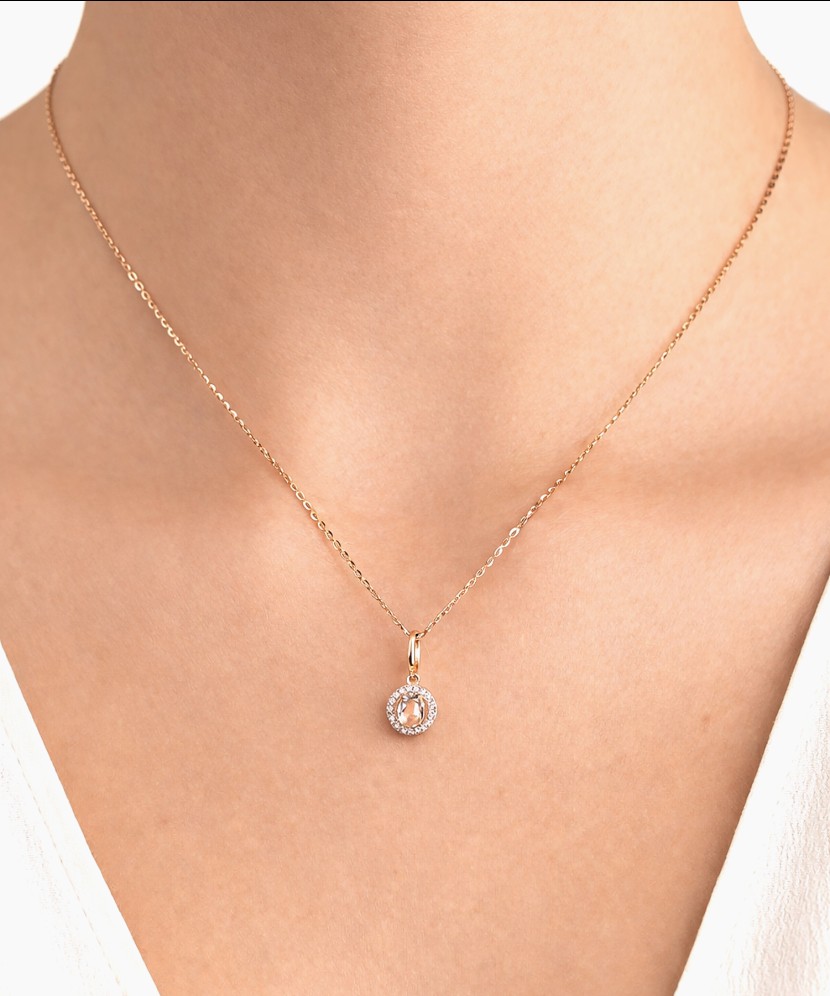 Gold pendant with white topaz and diamonds