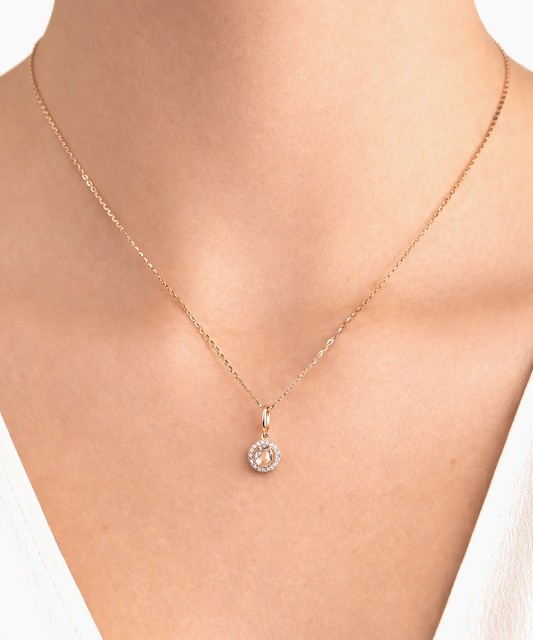 Gold pendant with white topaz and diamonds