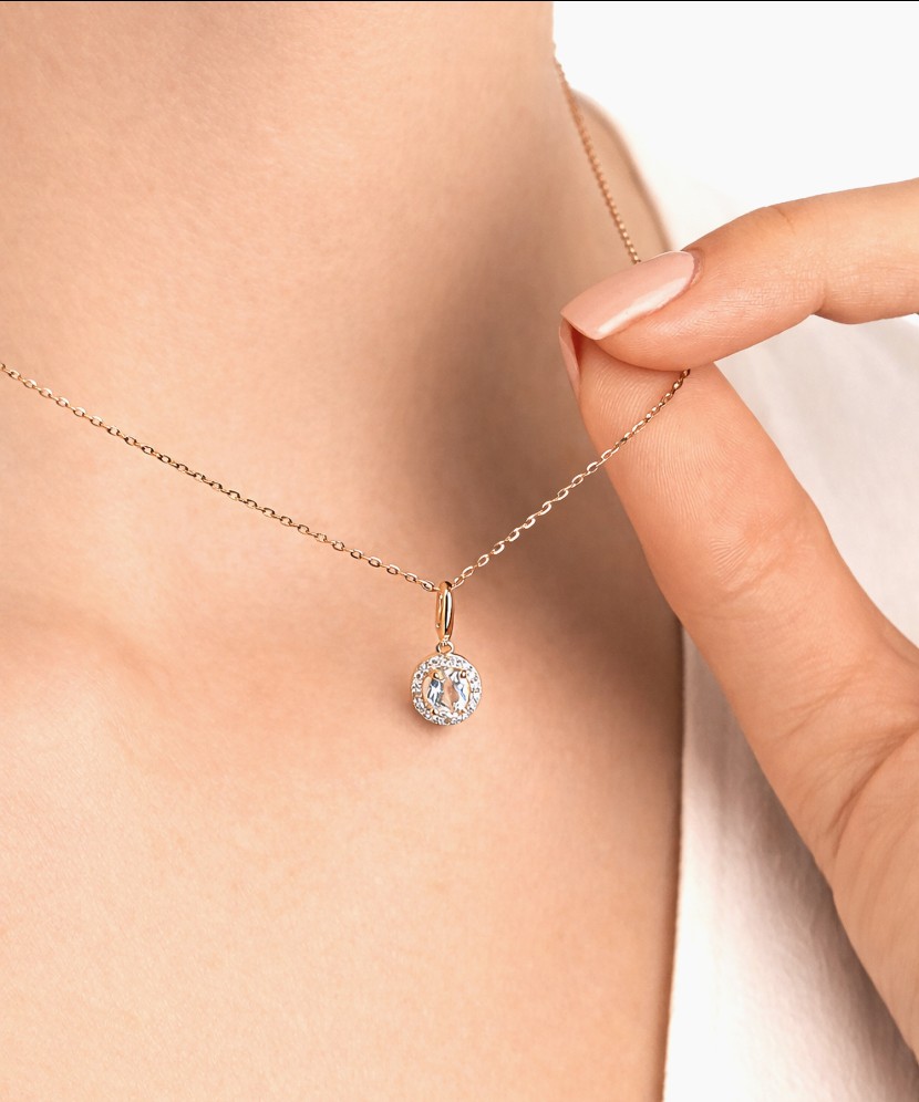 Gold pendant with white topaz and diamonds