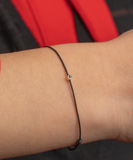 Black string bracelet with black diamond and yellow gold