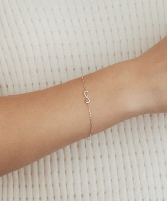 White gold bracelet with zircons "Infinity"