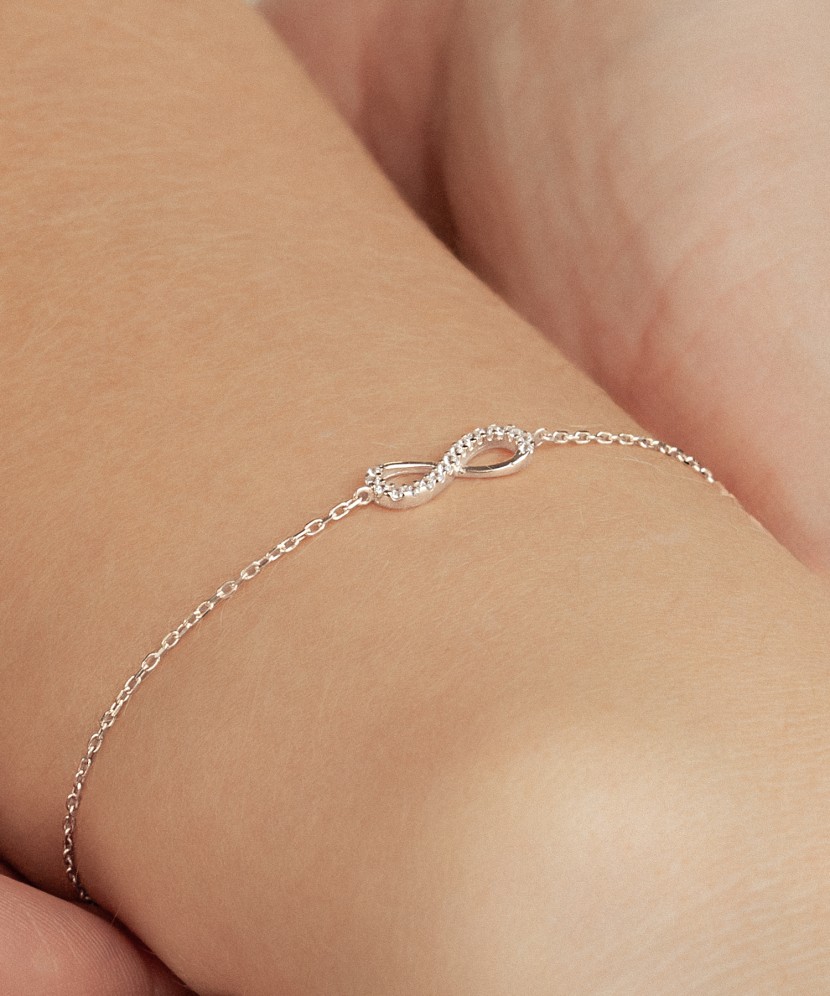 White gold bracelet with zircons "Infinity"