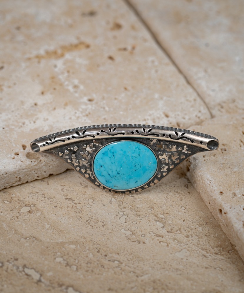 Silver brooch with turquoise