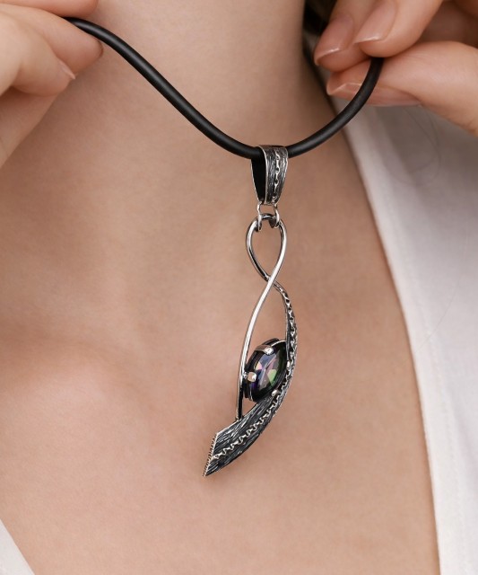 Silver pendant with mystical topaz