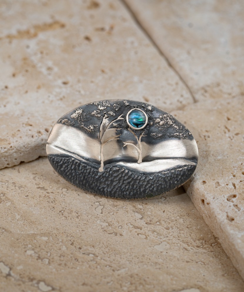 Silver brooch with mother-of-pearl
