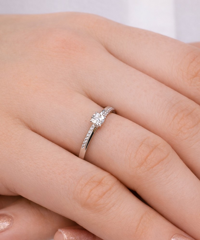 White gold ring with zircons