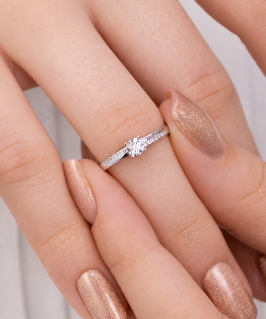 White gold ring with zircons