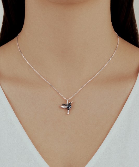 White gold pendant with diamonds, black diamonds and London topaz