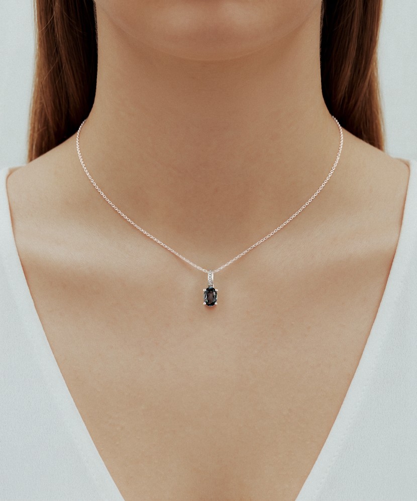 White gold pendant with diamonds and London topaz