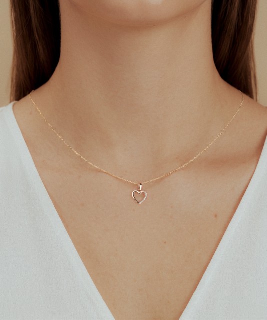 Gold pendant with zircons "heart"