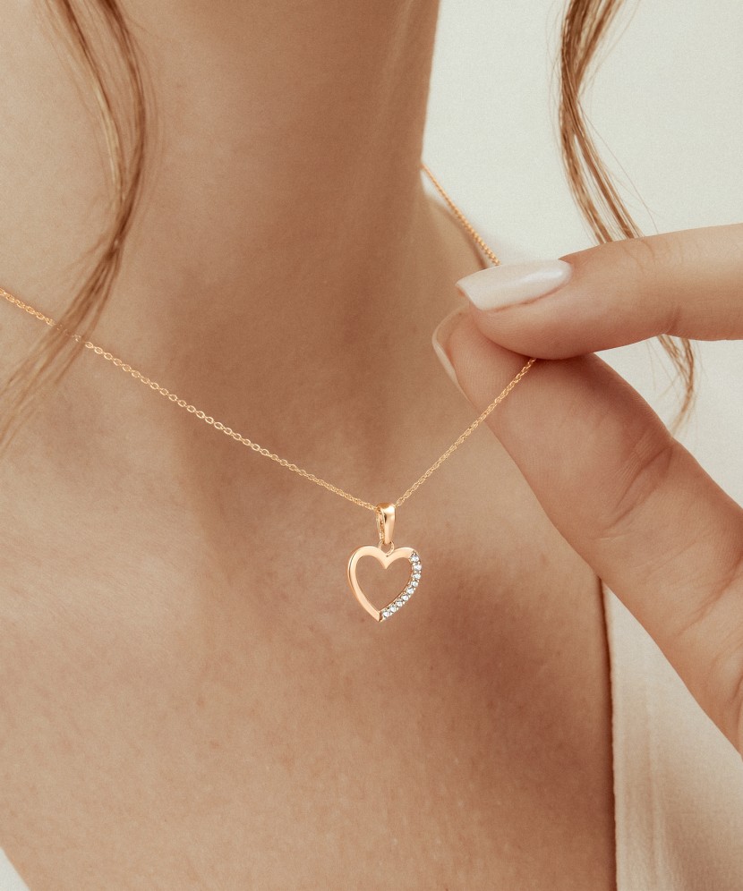 Gold pendant with zircons "heart"
