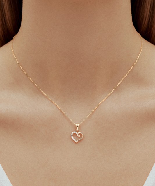 Gold pendant with zircons "heart"