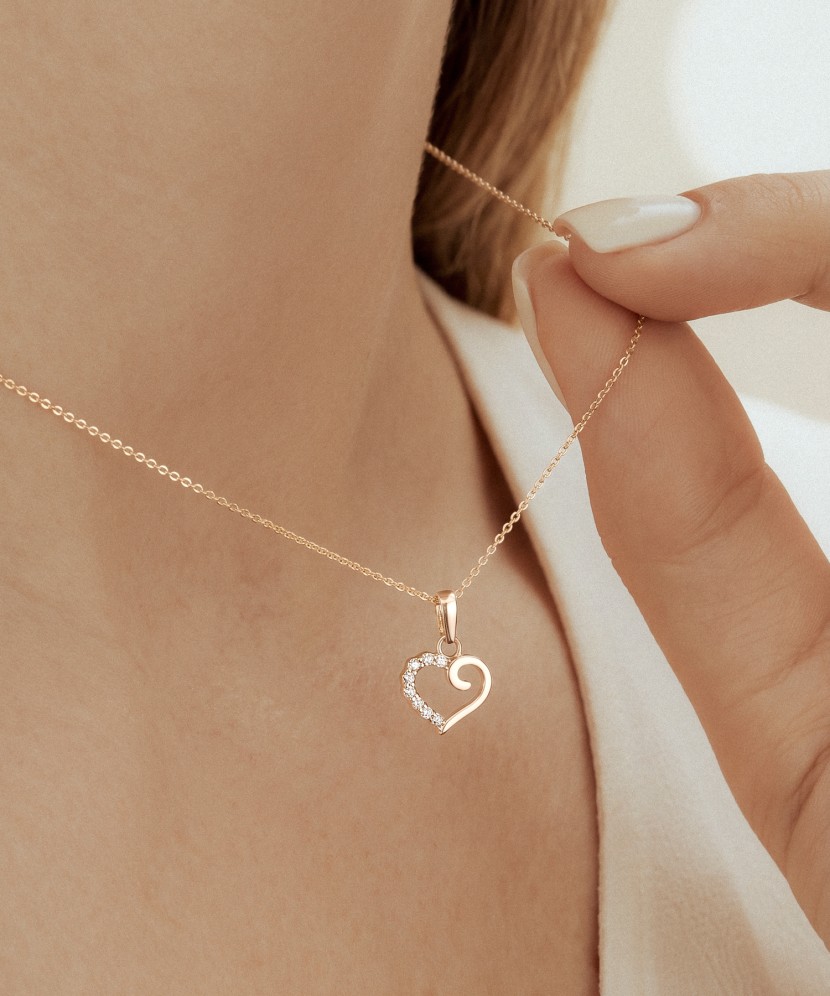Gold pendant with zircons "heart"