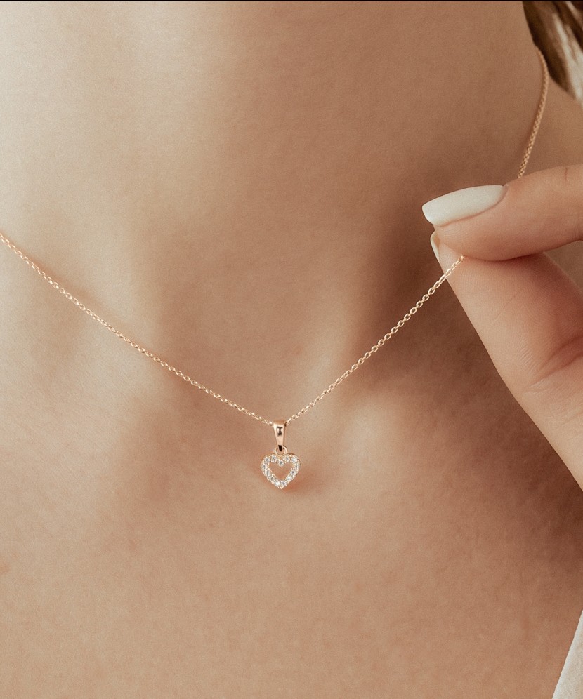Gold pendant with zircons "heart"