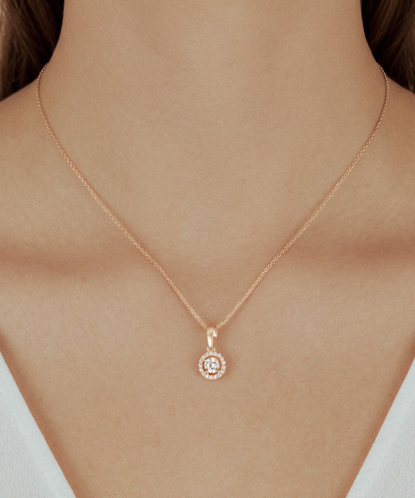 Gold pendant with zircons