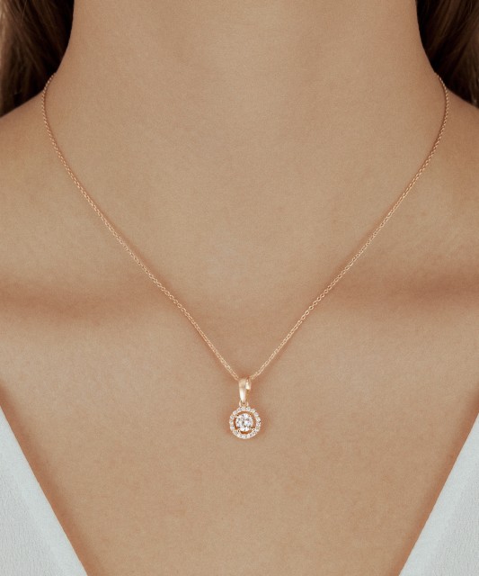 Gold pendant with zircons