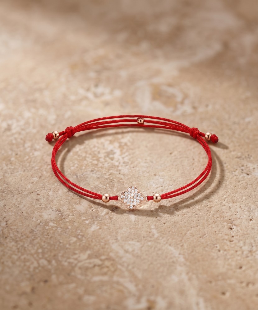 Red string bracelet with gold zirconia pendant