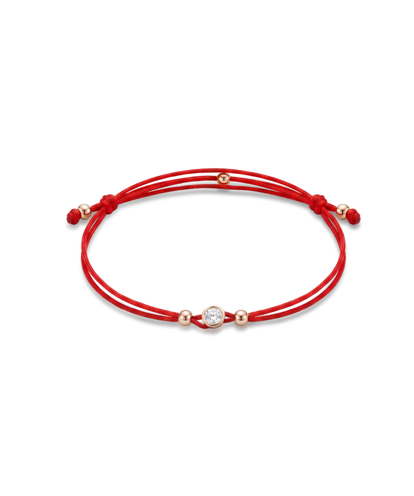 Red string bracelet with gold zirconia pendant