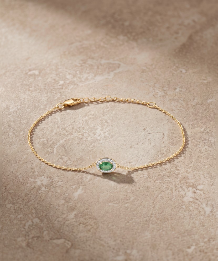 Yellow gold bracelet with emerald and diamonds