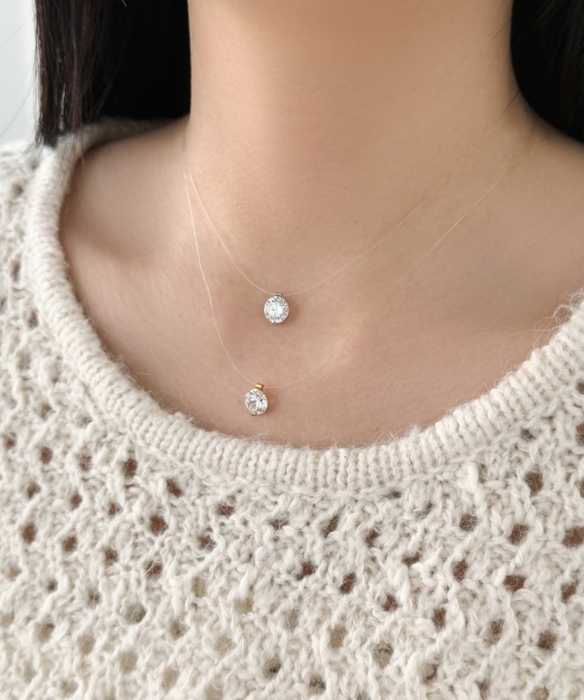 Silver pendant with zircon on clear silicone thread