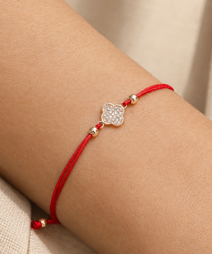 Red string bracelet with gold zirconia pendant