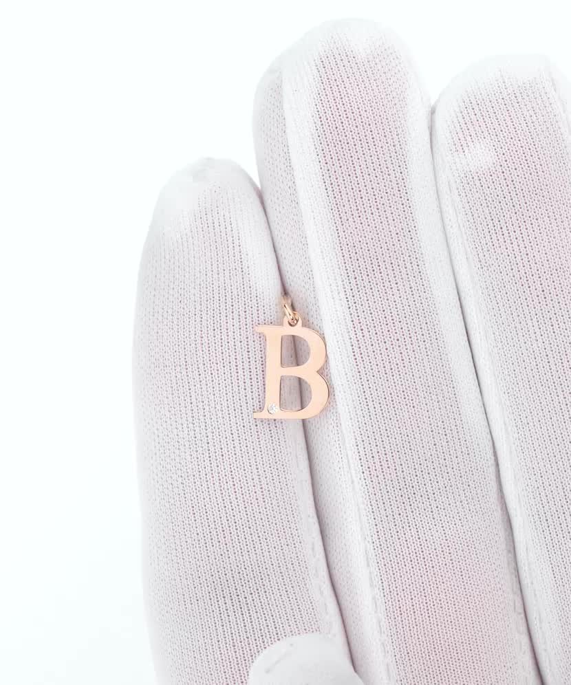 Gold pendant with diamond letter B