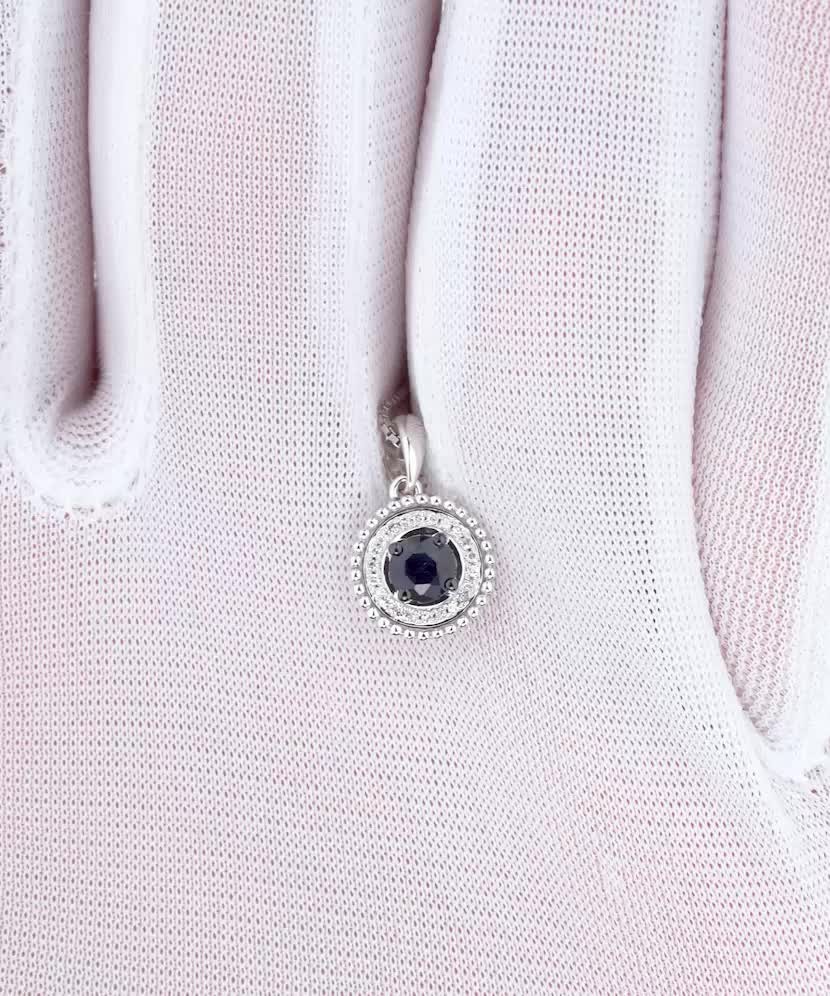 White gold pendant with diamonds and sapphires