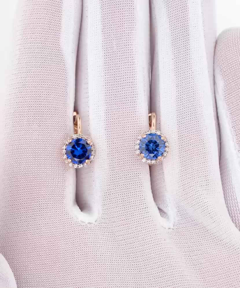 Gold earrings with zircons