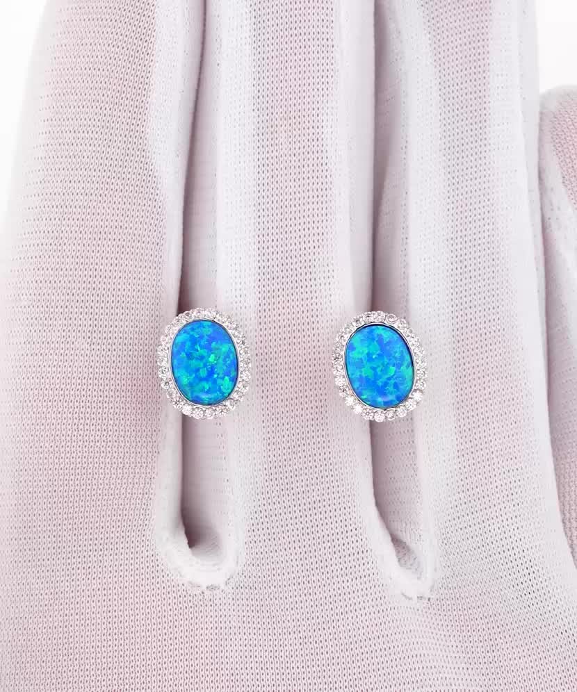 Gold earrings with opal and zircons