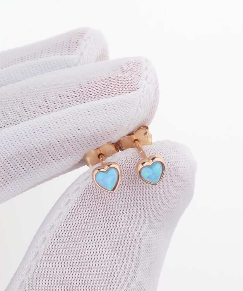Gold earrings with opal "hearts"