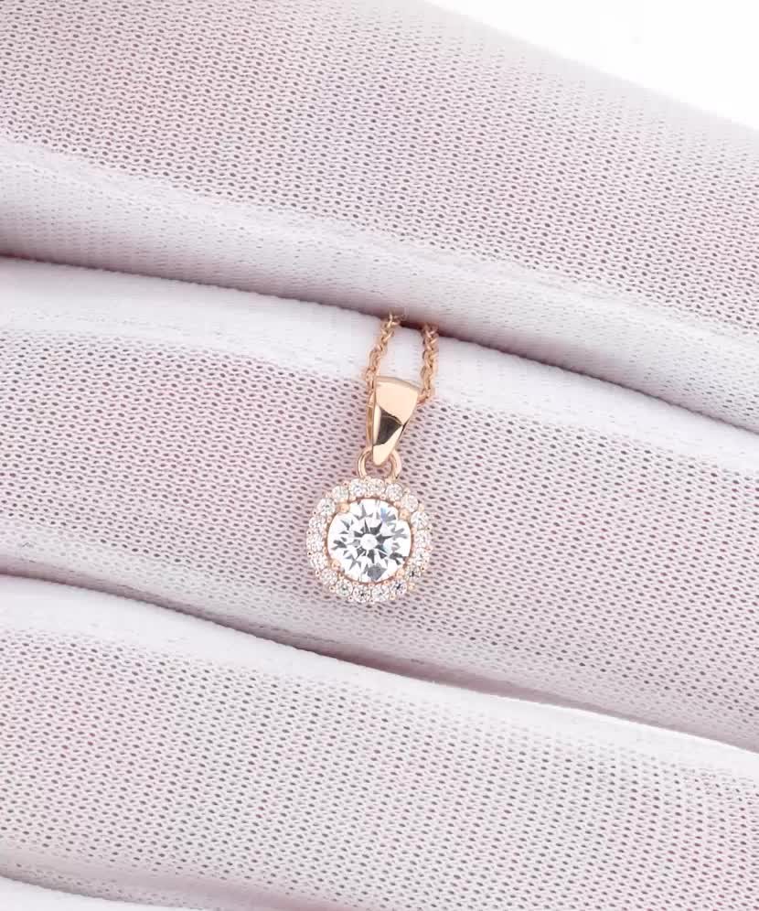 Gold pendant with zircons