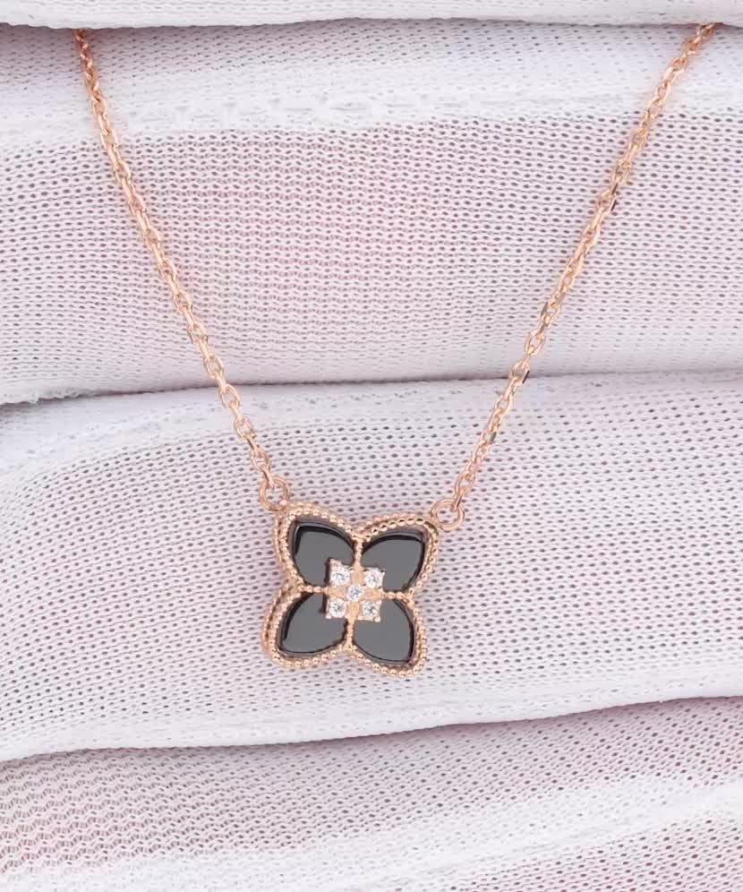 Gold chain with onyx pendant