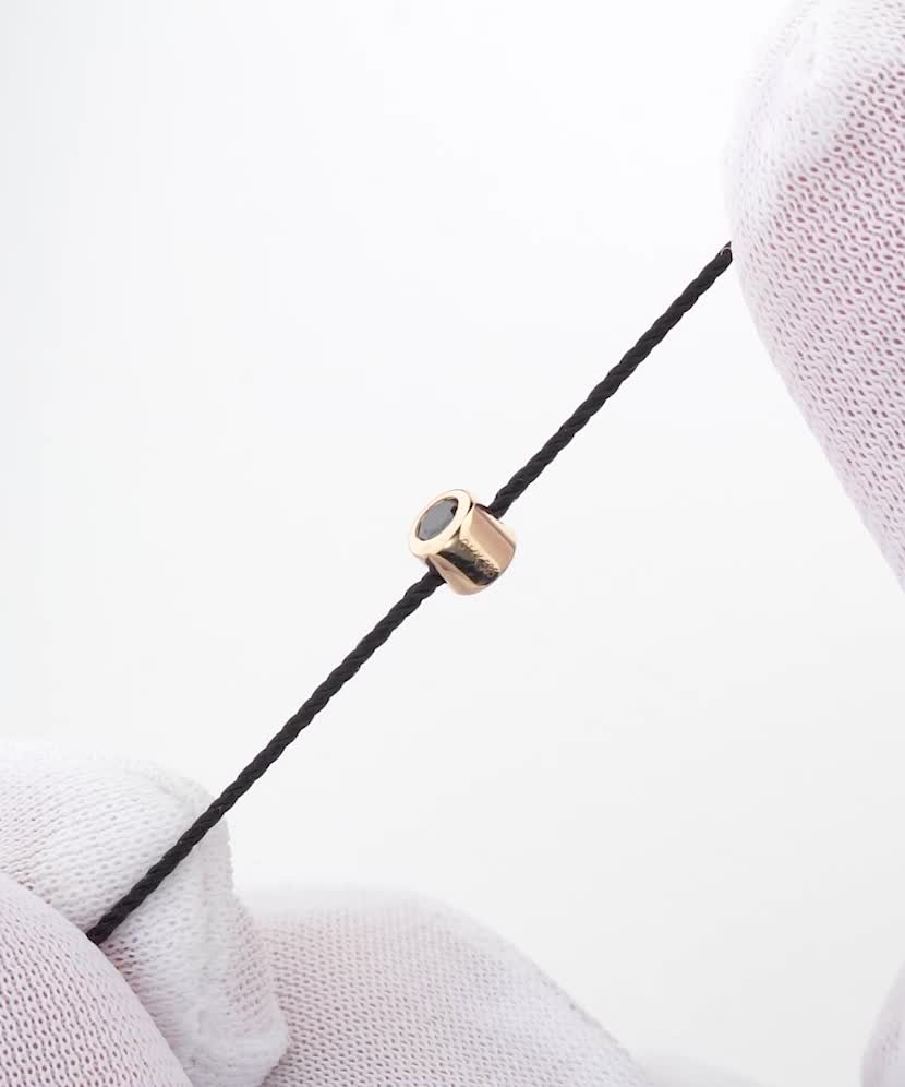 Black string bracelet with black diamond and yellow gold
