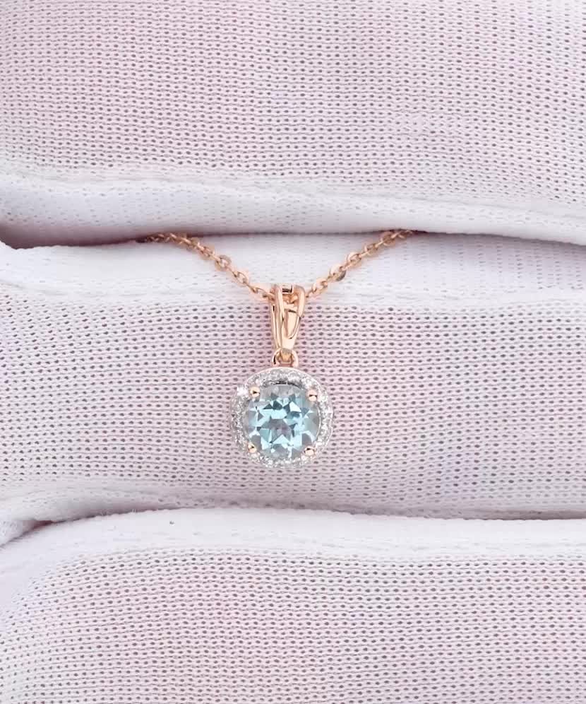 Gold pendant with topaz and diamonds