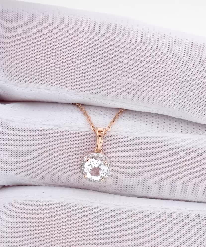 Gold pendant with white topaz and diamonds